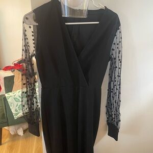 Elegant Black Dress with Sheer Polka Dot Sleeves